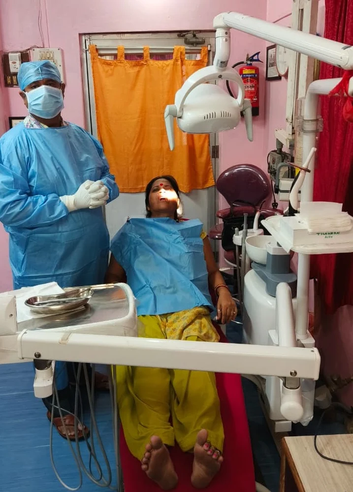 Dentist with a patient in the treatment chair