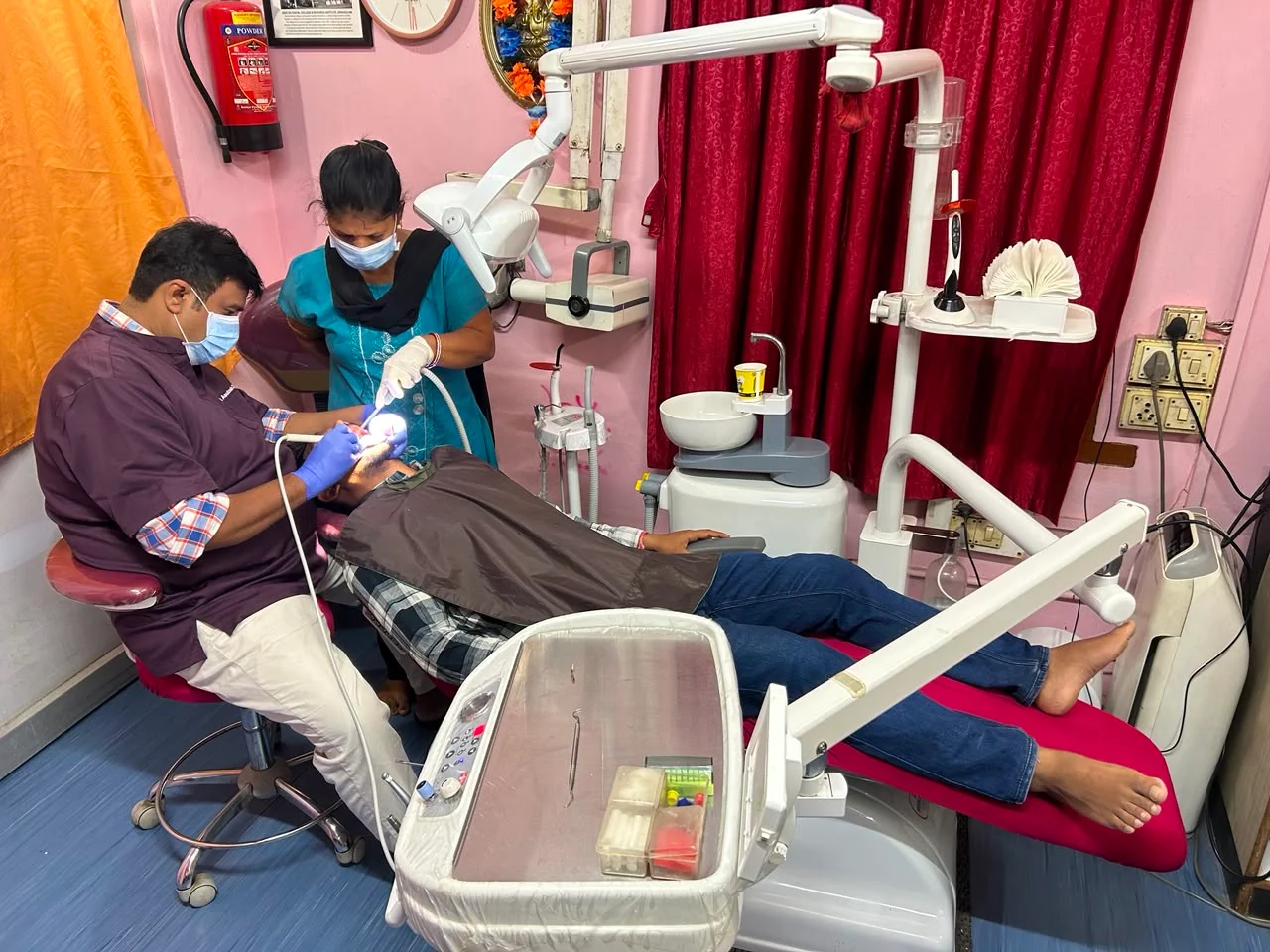 Dental procedure with dentist and assistant