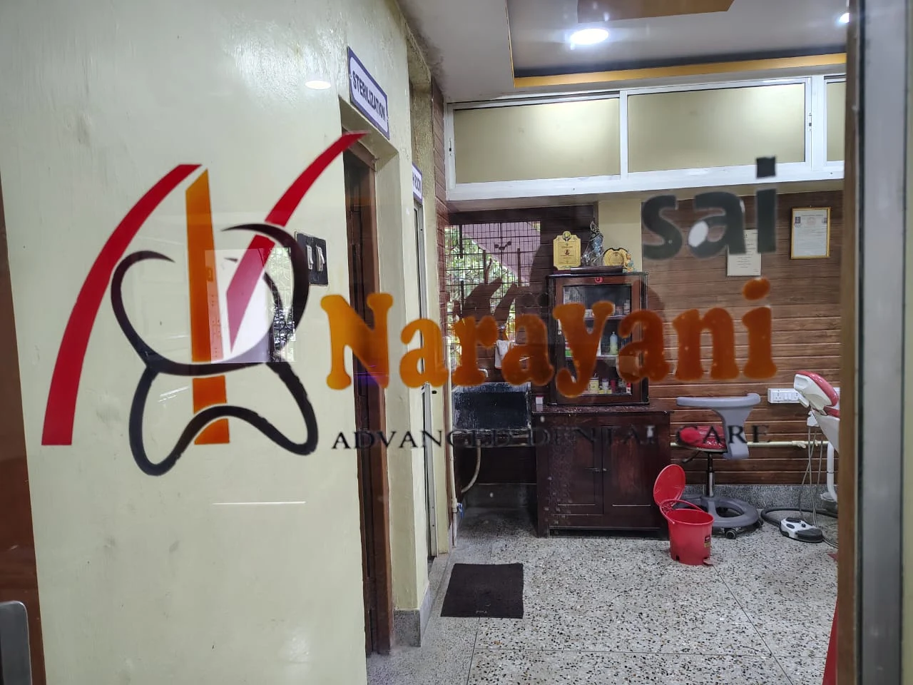 Sai Narayani Advanced Dental Care logo on the entrance door
